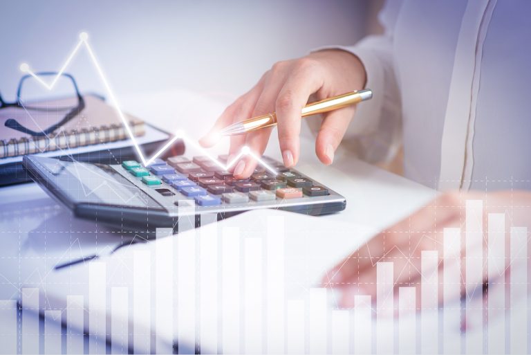 accountant calculating profit with financial analysis graphs